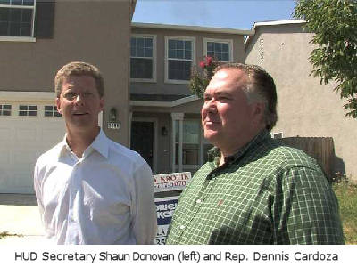 HUD Secretary Saun Donovan and Dennis Cardoza in front of a foreclosed home in Merced, Calif