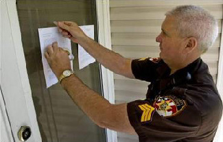Sheriff posting a foreclosure notice