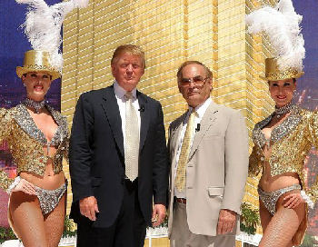 Donald Trump and Phillip Ruffin accompanied by two Las Vegas Showgirls