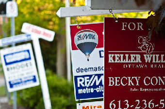 mulitple for sale signs