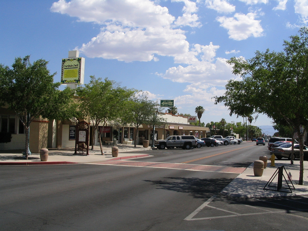 small town store fronts with blue skies and white clouds