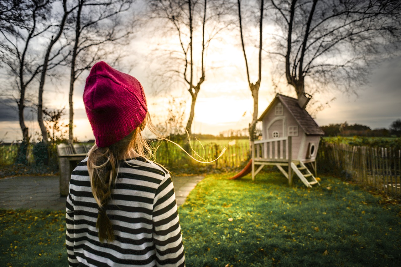 Girl looking at treehouse