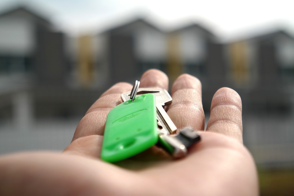 key in person’s hand