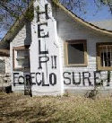 help sign painted on a foreclosed home