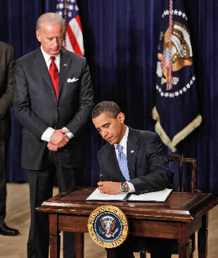 Obama signing an executive order