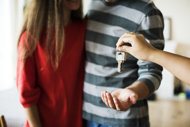 Couple getting new home keys